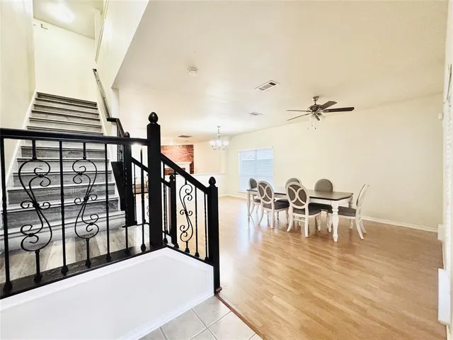 a view of a dining room with furniture and a table