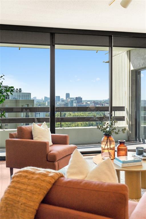 2660 Peachtree Road Northwest, Unit 19A Atlanta, GA 30305 - Photo 11 of 51 a bedroom with furniture and a large window