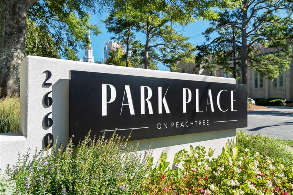 2660 Peachtree Road Northwest, Unit 19A Atlanta, GA 30305 - Photo 2 of 51 a street sign that is on a wooden wall