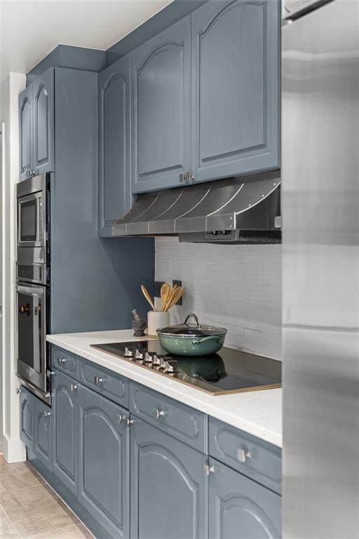 2660 Peachtree Road Northwest, Unit 19A Atlanta, GA 30305 - Photo 27 of 51 a kitchen with stainless steel appliances granite countertop a sink and cabinets
