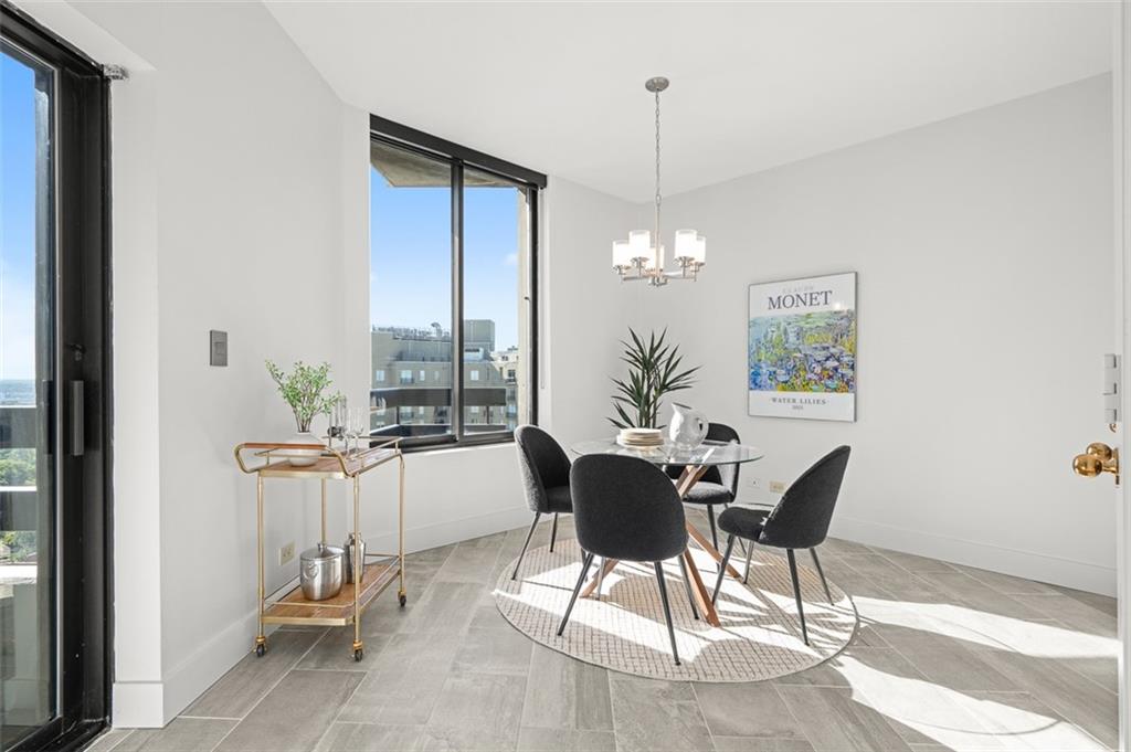 2660 Peachtree Road Northwest, Unit 19A Atlanta, GA 30305 - Photo 28 of 51 a view of a dining room with furniture window and outside view