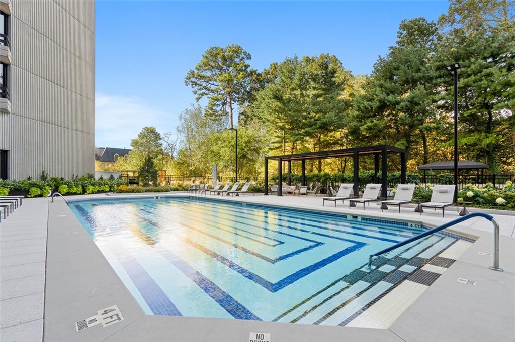 2660 Peachtree Road Northwest, Unit 19A Atlanta, GA 30305 - Photo 42 of 51 a view of swimming pool with chairs