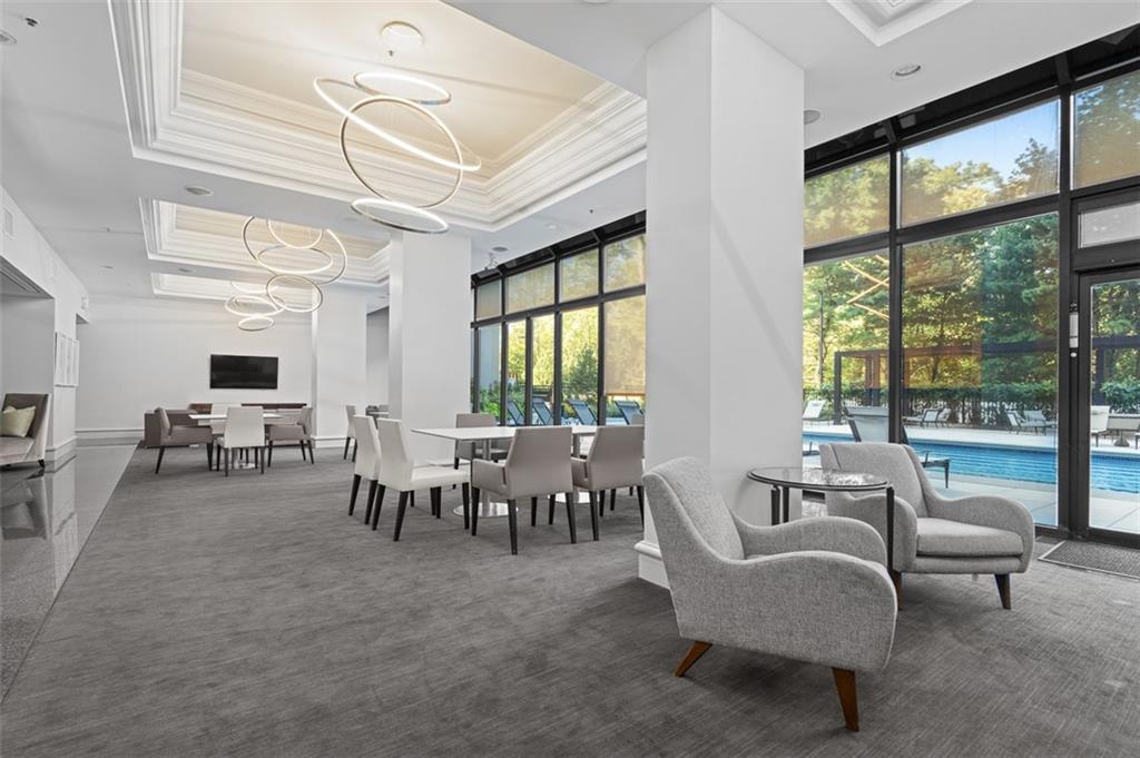 2660 Peachtree Road Northwest, Unit 19A Atlanta, GA 30305 - Photo 43 of 51 a living room with furniture and a large window