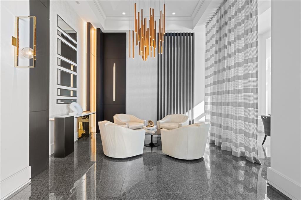 2660 Peachtree Road Northwest, Unit 19A Atlanta, GA 30305 - Photo 47 of 51 a living room with furniture and a window