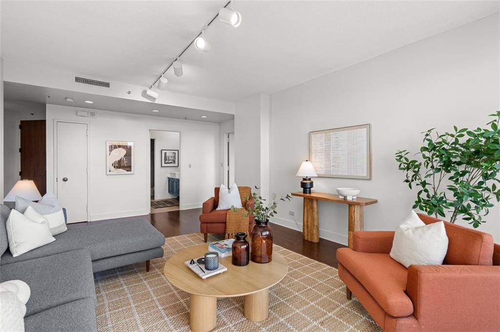 2660 Peachtree Road Northwest, Unit 19A Atlanta, GA 30305 - Photo 10 of 51 a living room with furniture kitchen view and a potted plant