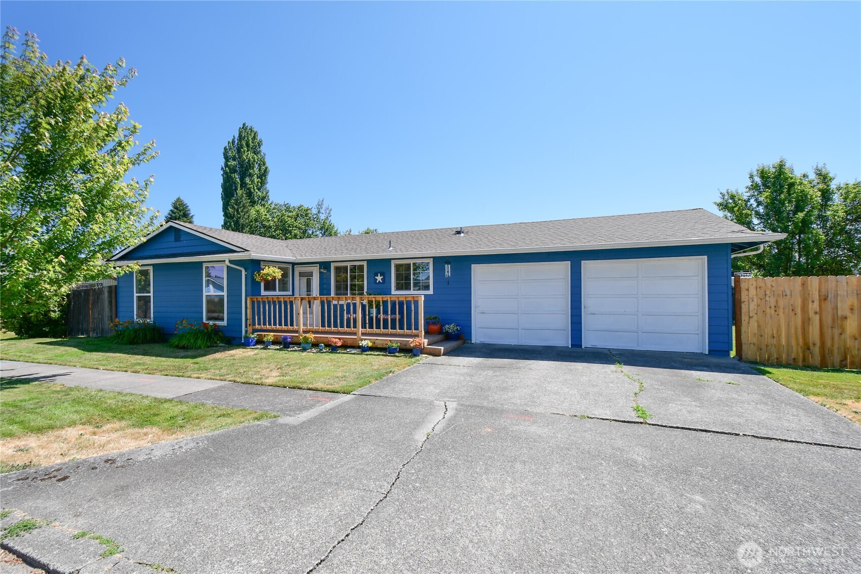 2102 35th Avenue Longview, WA 98632 - Photo 1 of 31 a front view of a house with a yard and garage
