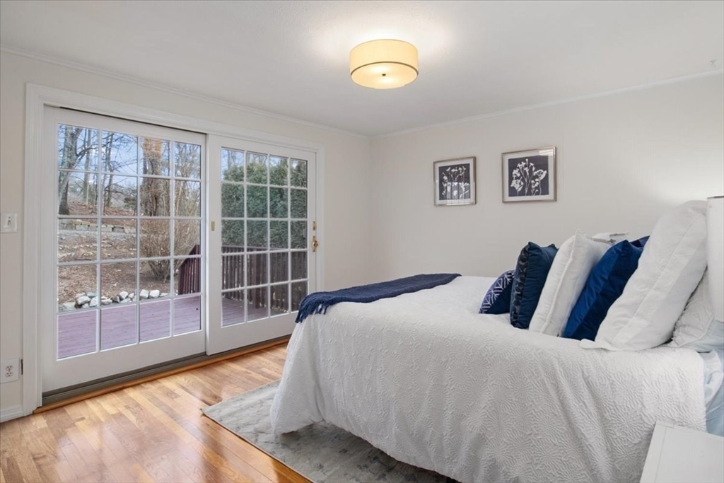 136 Beechnut Road Westwood, MA 02090 - Photo 17 of 42 a bedroom with a large bed and a large window