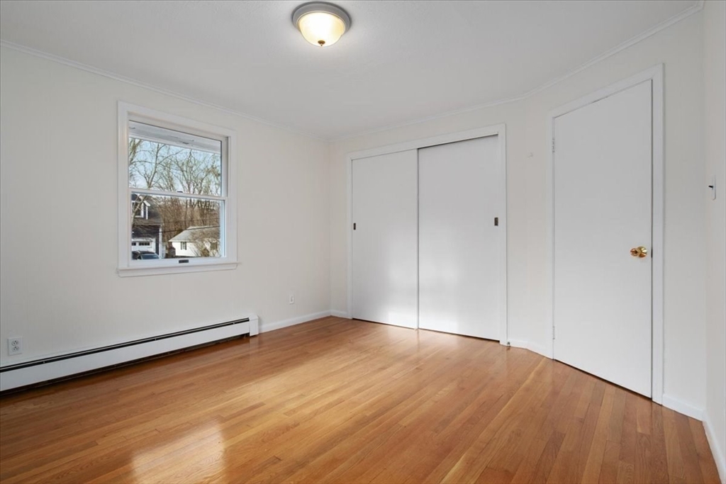 136 Beechnut Road Westwood, MA 02090 - Photo 21 of 42 an empty room with wooden floor and windows