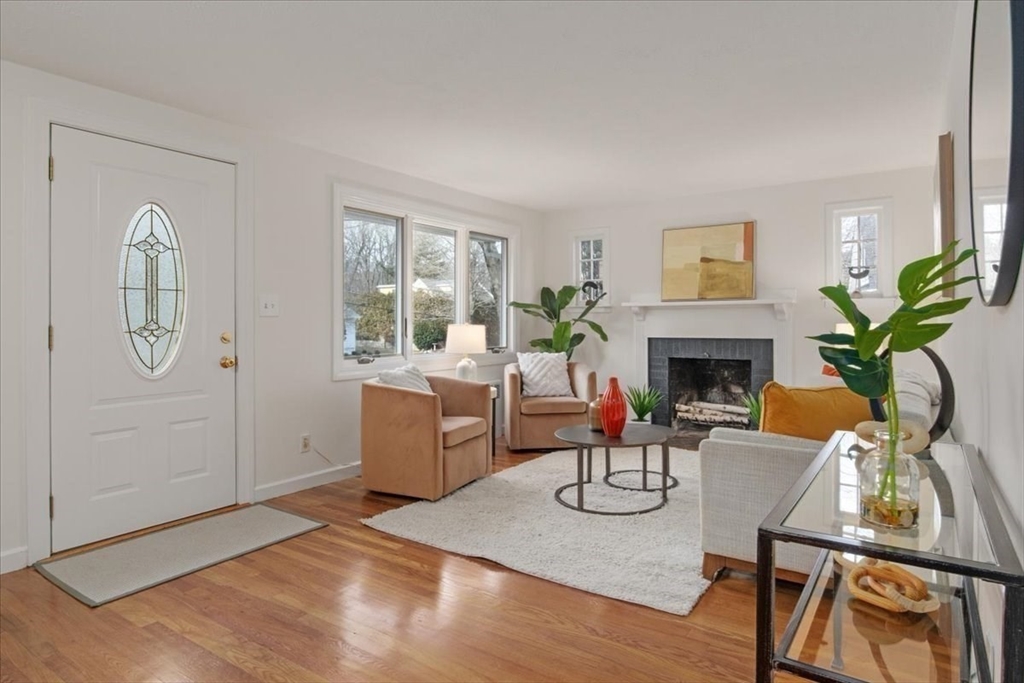 136 Beechnut Road Westwood, MA 02090 - Photo 5 of 42 a living room with furniture a fireplace and a potted plant