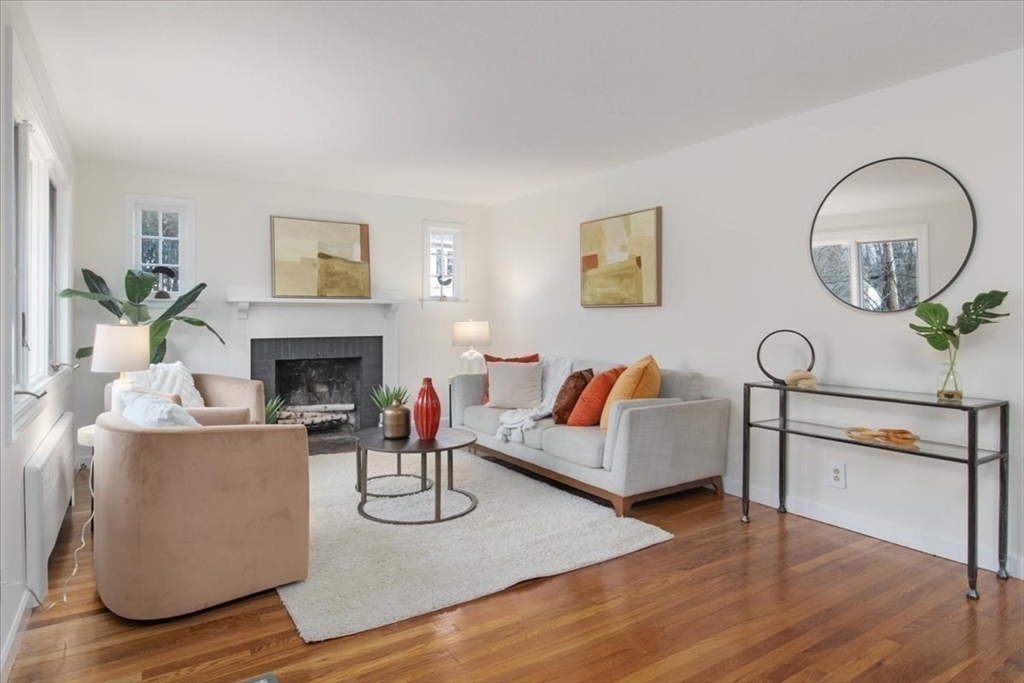 136 Beechnut Road Westwood, MA 02090 - Photo 6 of 42 a living room with furniture a fireplace and paintings on the wall