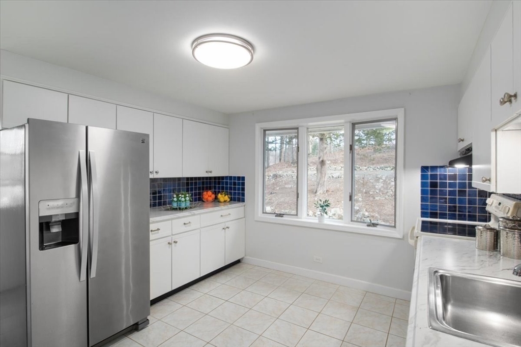 136 Beechnut Road Westwood, MA 02090 - Photo 9 of 42 a kitchen with stainless steel appliances a refrigerator and a sink