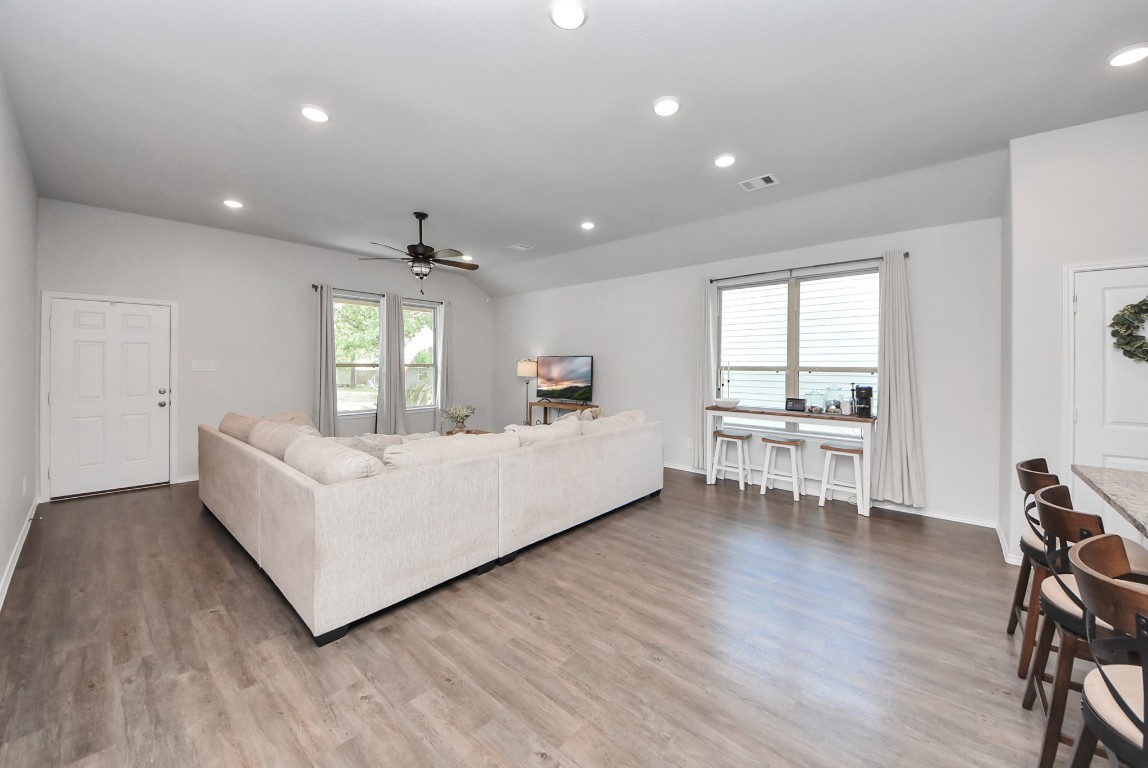 709 Little River Drive Montgomery, TX 77316 - Photo 11 of 40 a living room with furniture and a wooden floor