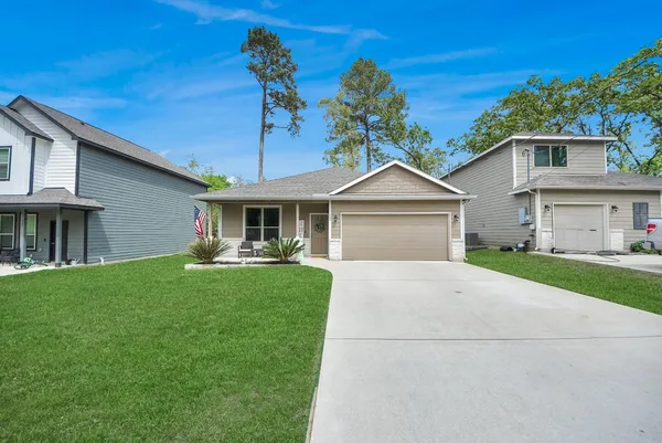 a front view of a house with a garden and porch