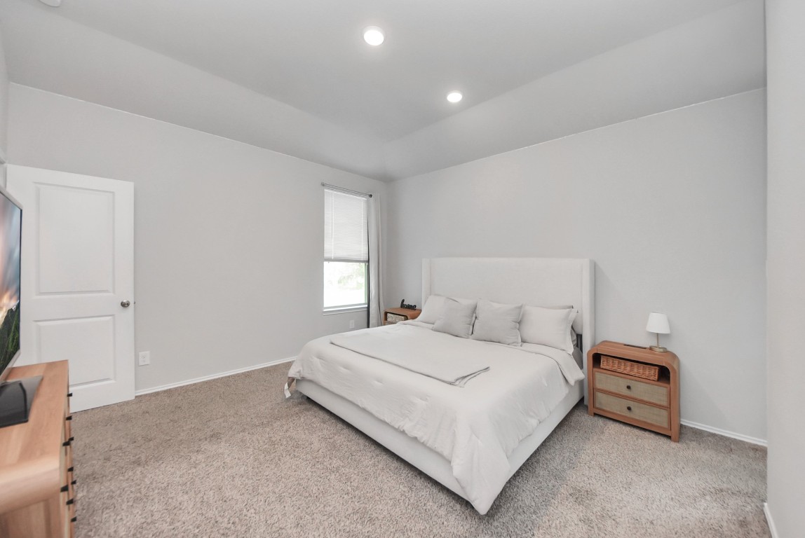 709 Little River Drive Montgomery, TX 77316 - Photo 22 of 40 a bedroom with a bed and a window