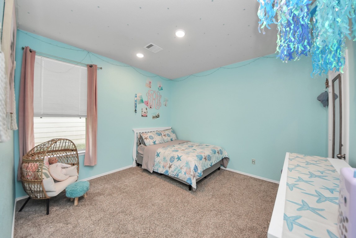 709 Little River Drive Montgomery, TX 77316 - Photo 28 of 40 a bedroom with a bed and a window