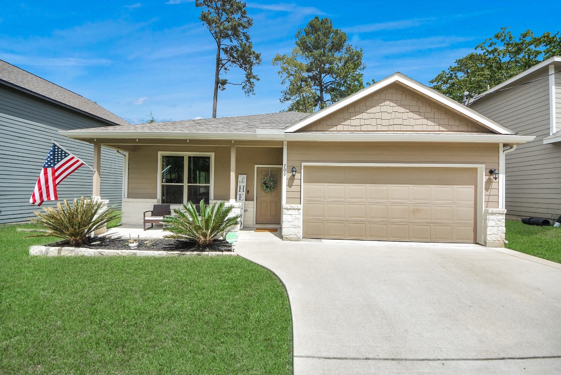 709 Little River Drive Montgomery, TX 77316 - Photo 40 of 40 a front view of a house with a yard