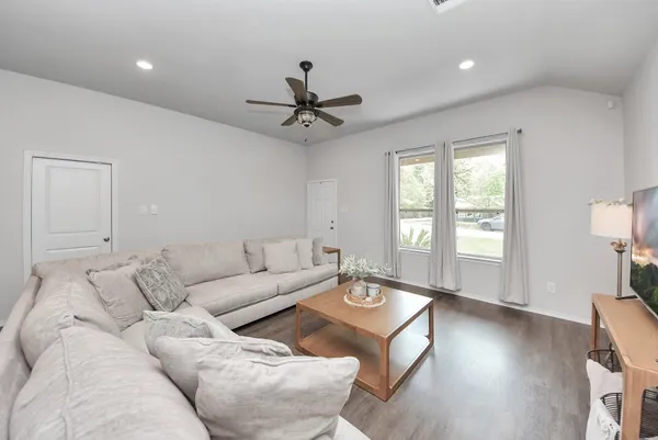 a living room with furniture and a window