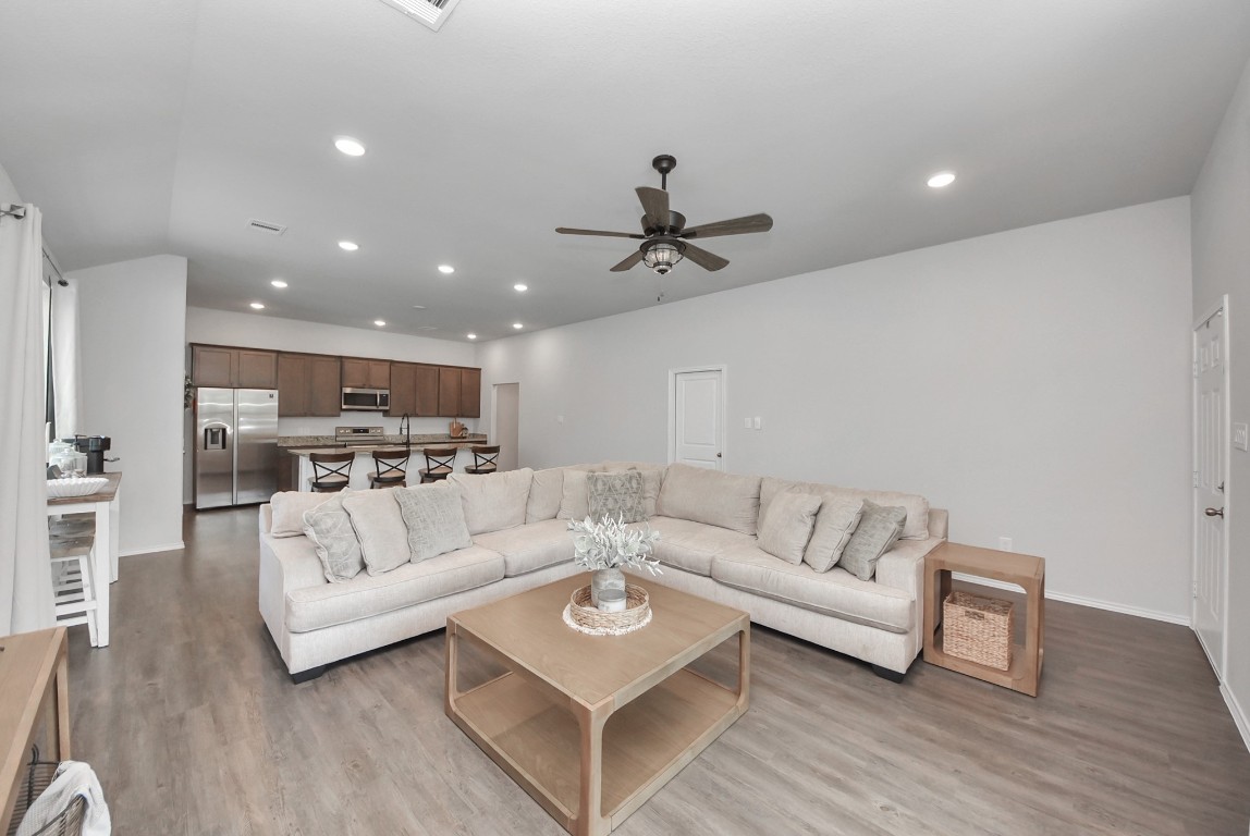 709 Little River Drive Montgomery, TX 77316 - Photo 9 of 40 a living room with furniture and a wooden floor