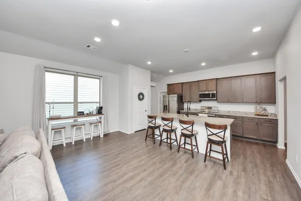 a kitchen with a table and chairs in it