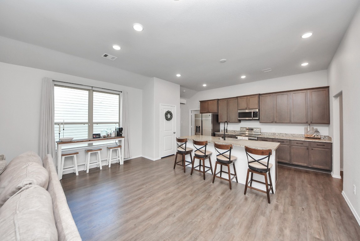 709 Little River Drive Montgomery, TX 77316 - Photo 10 of 40 a kitchen with a table and chairs in it