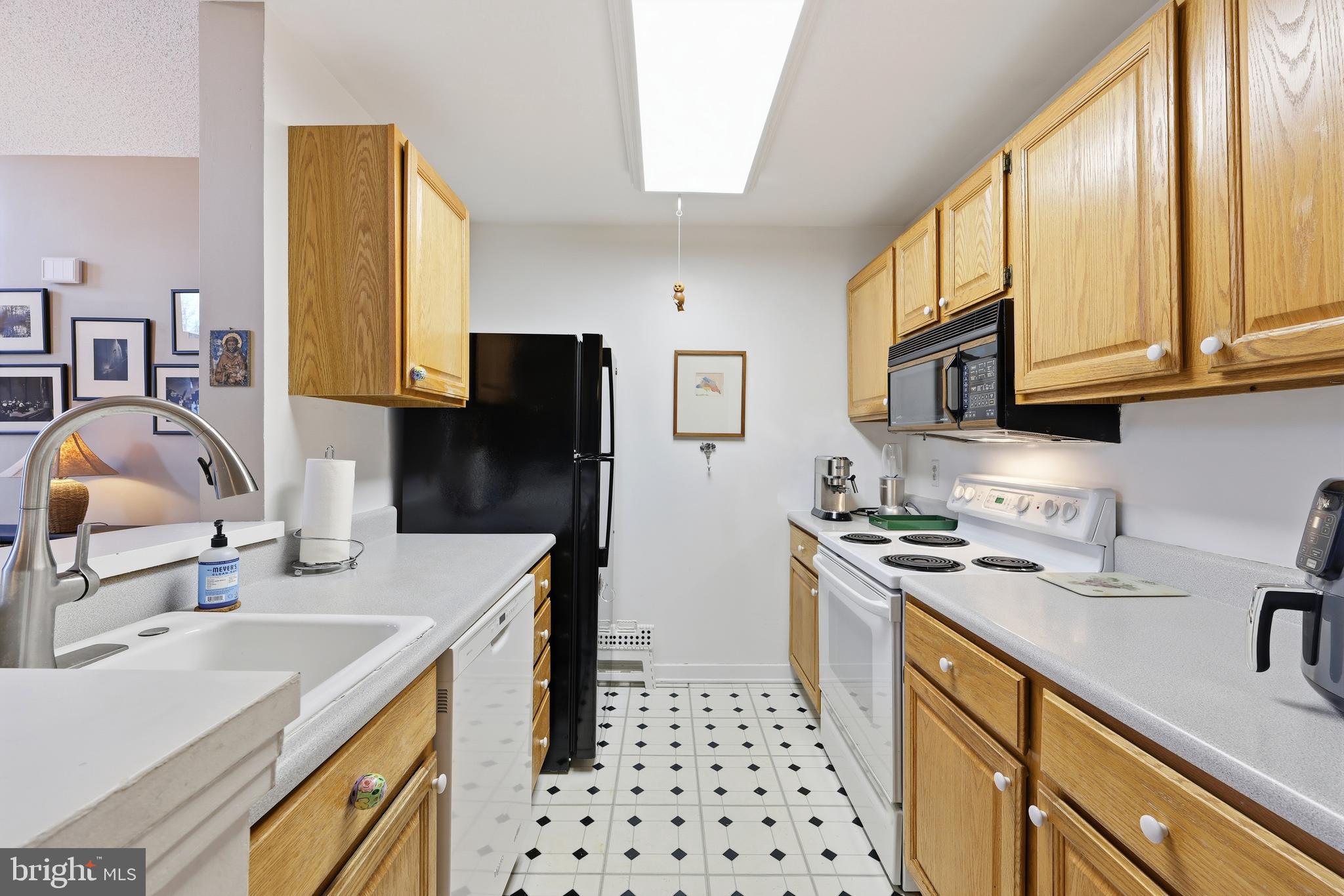 706 Augusta Circle Mount Laurel, NJ 08054 - Photo 15 of 31 a kitchen with stainless steel appliances a sink a stove a refrigerator a sink a counter space and cabinets
