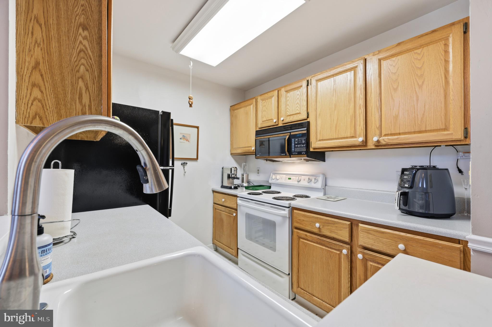 706 Augusta Circle Mount Laurel, NJ 08054 - Photo 16 of 31 a kitchen with stainless steel appliances granite countertop a sink a stove a microwave and cabinets