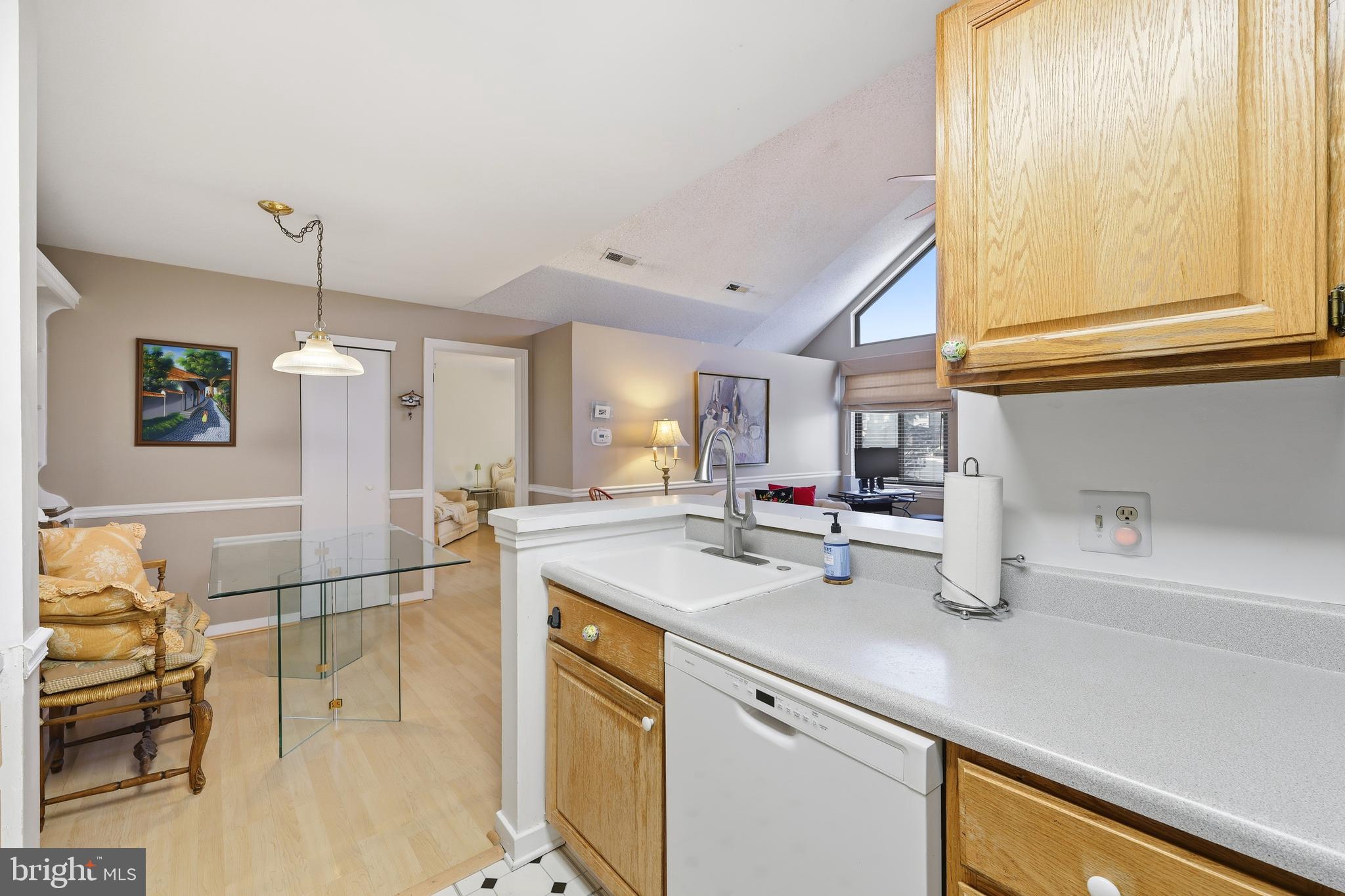 706 Augusta Circle Mount Laurel, NJ 08054 - Photo 18 of 31 a kitchen with a sink a counter top space and living room area