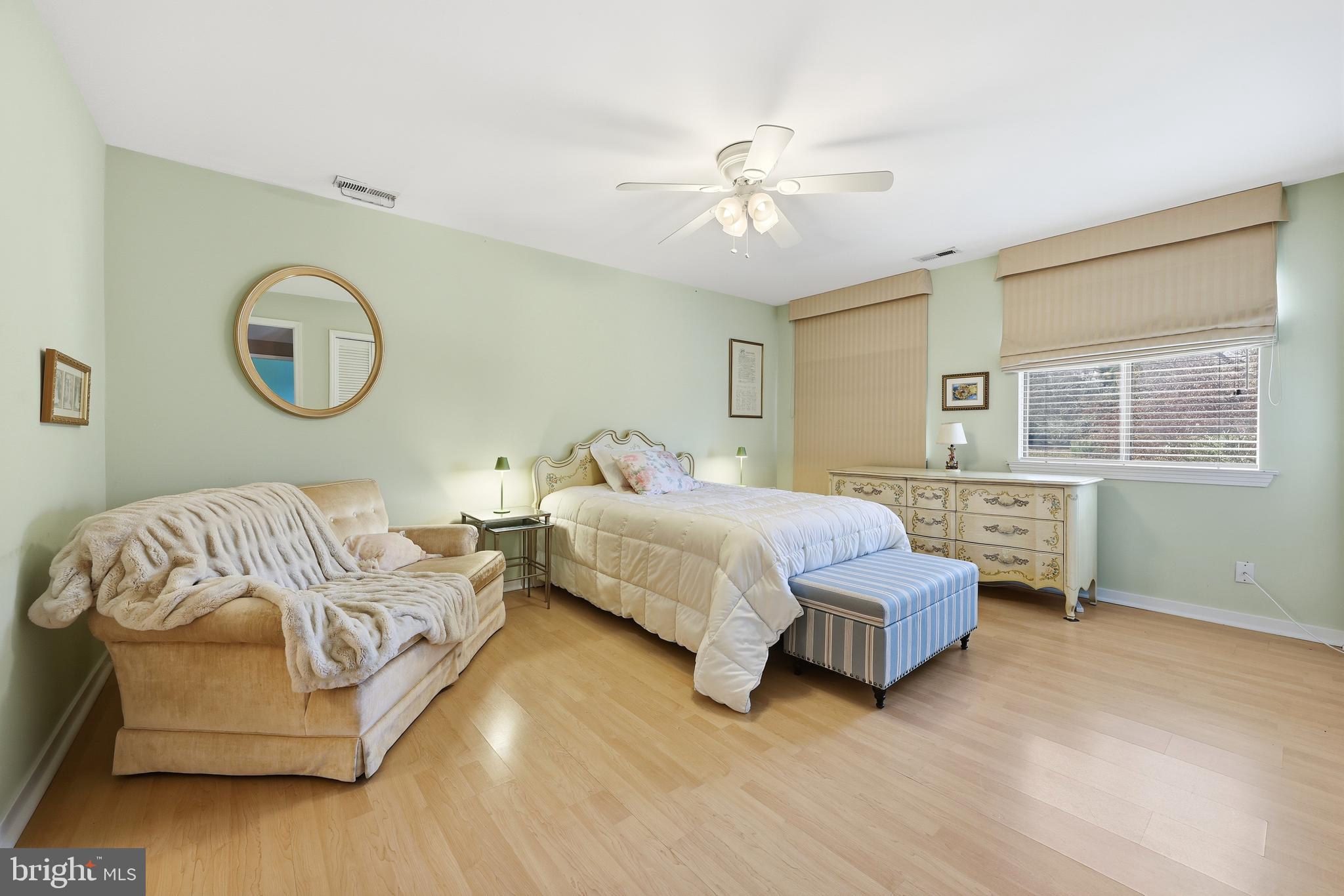 706 Augusta Circle Mount Laurel, NJ 08054 - Photo 19 of 31 a bedroom with a bed and a chandelier