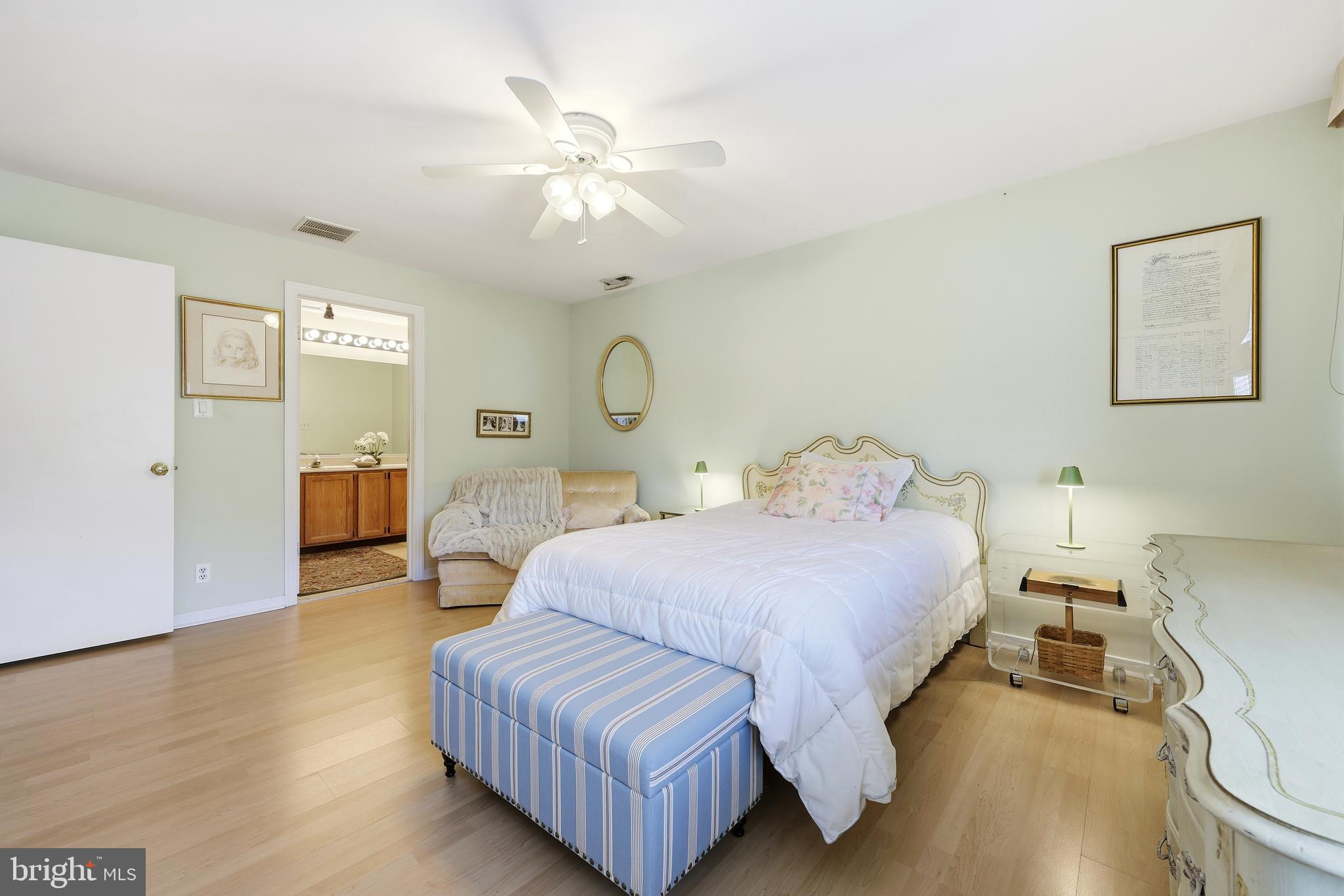 706 Augusta Circle Mount Laurel, NJ 08054 - Photo 20 of 31 a bedroom with a bed and a chandelier