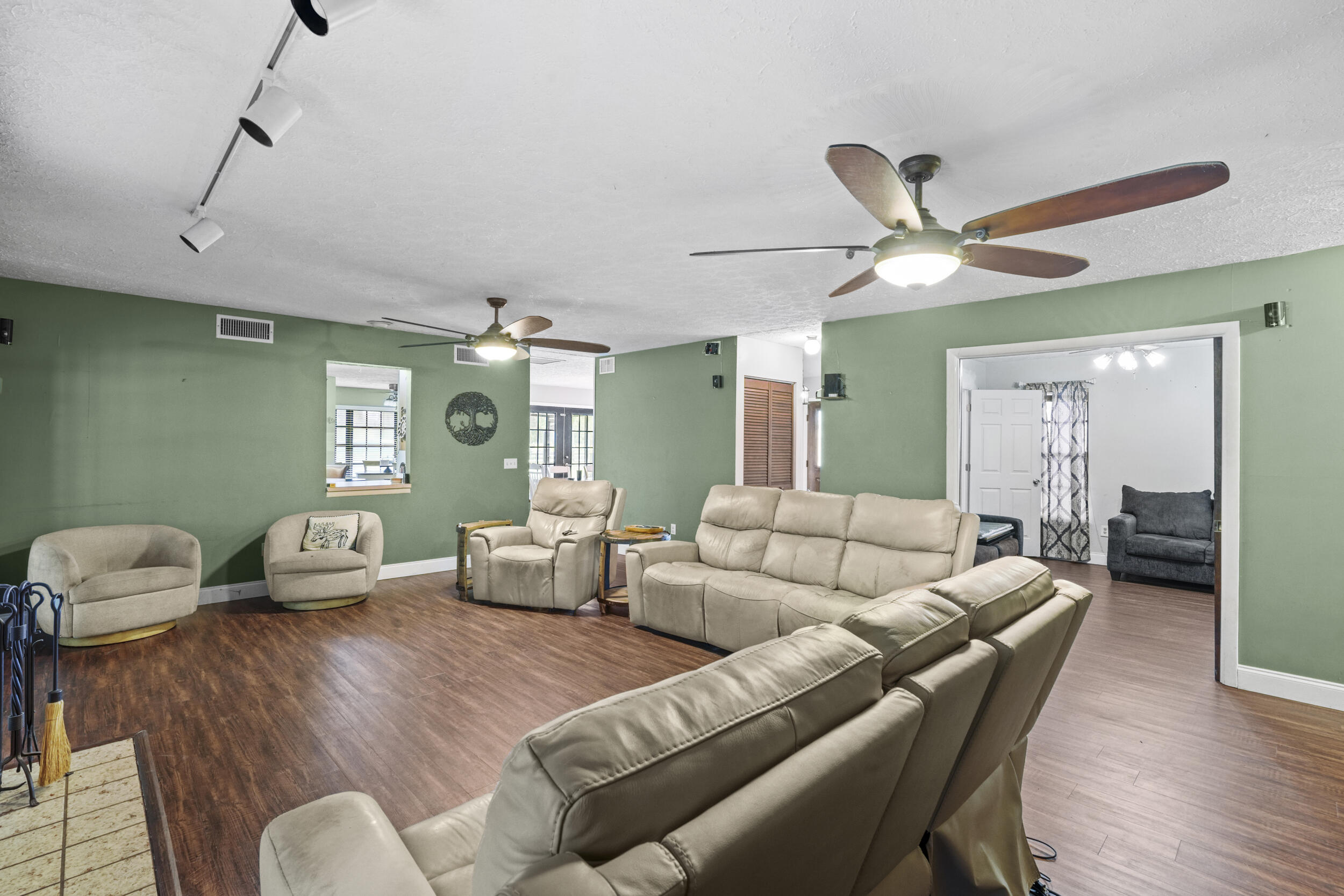 4170 McCarty Road Fort Pierce, FL 34945 - Photo 15 of 57 a living room with furniture and a wooden floor