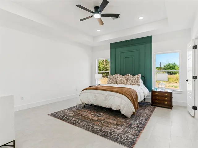 a bedroom with a bed and dresser