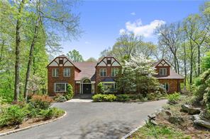 Magnificent Sun-Filled Tudor with quality craftsmanship, soaring ceilings and open-flow