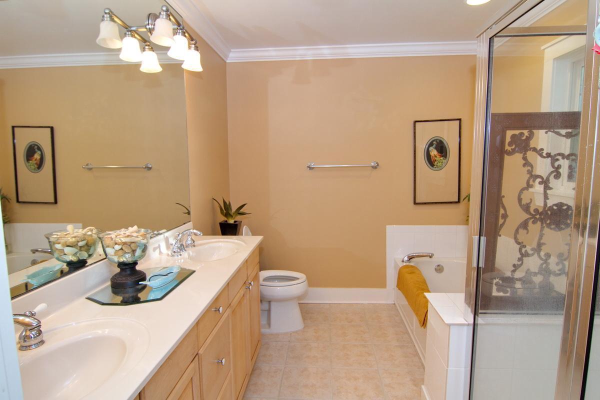1946 Bay Grove Road Freeport, FL 32439 - Photo 22 of 29 a bathroom with a sink a toilet and shower