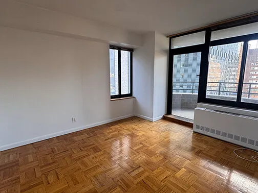 an empty room with large window