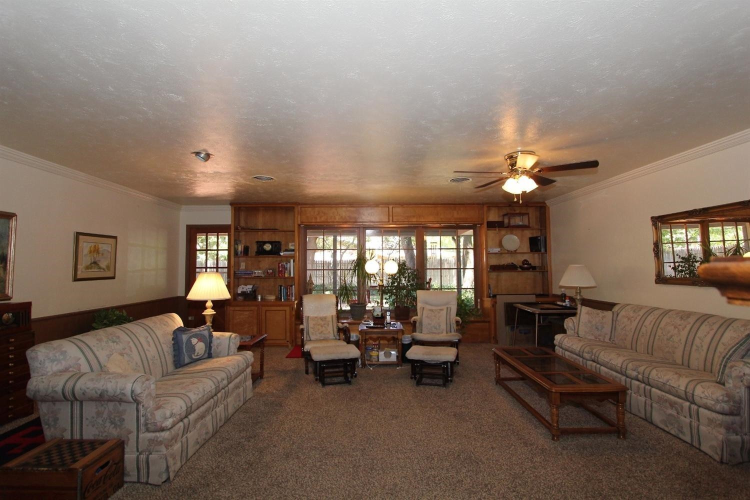 3412 60th Street Lubbock, TX 79413 - Photo 4 of 10 a living room with furniture and a large window