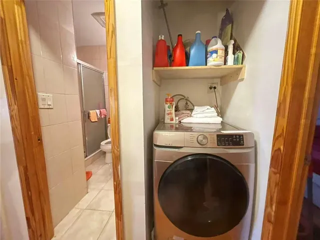 a bed room with a bed and a window