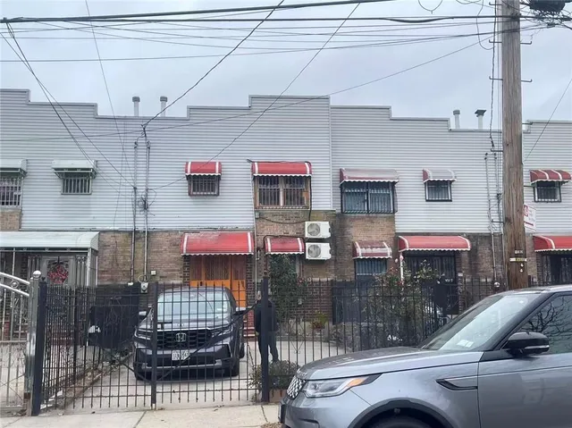 a kitchen with stainless steel appliances kitchen island granite countertop a table and chairs in it