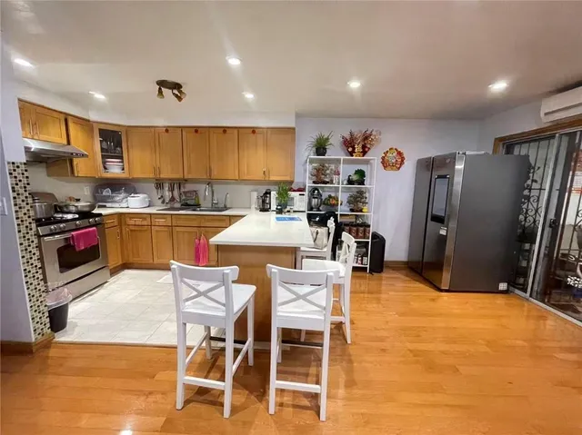 a living room with furniture and stairs