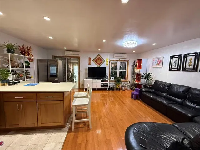 a kitchen with stainless steel appliances granite countertop a sink and a stove