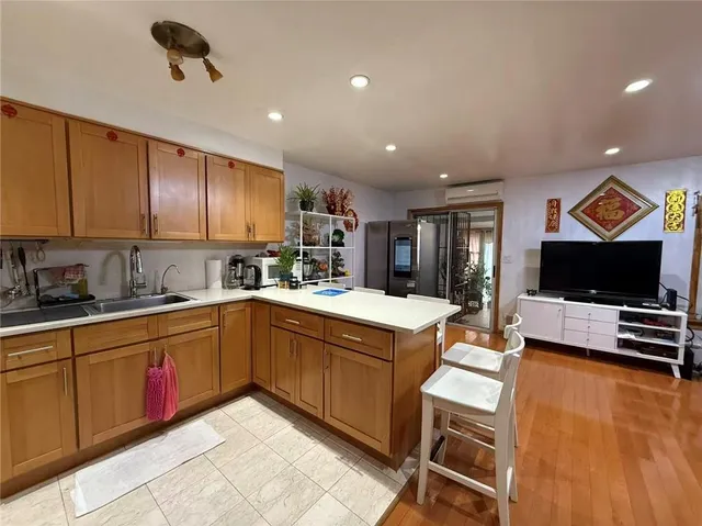 a view of a porch with chairs and potted plants
