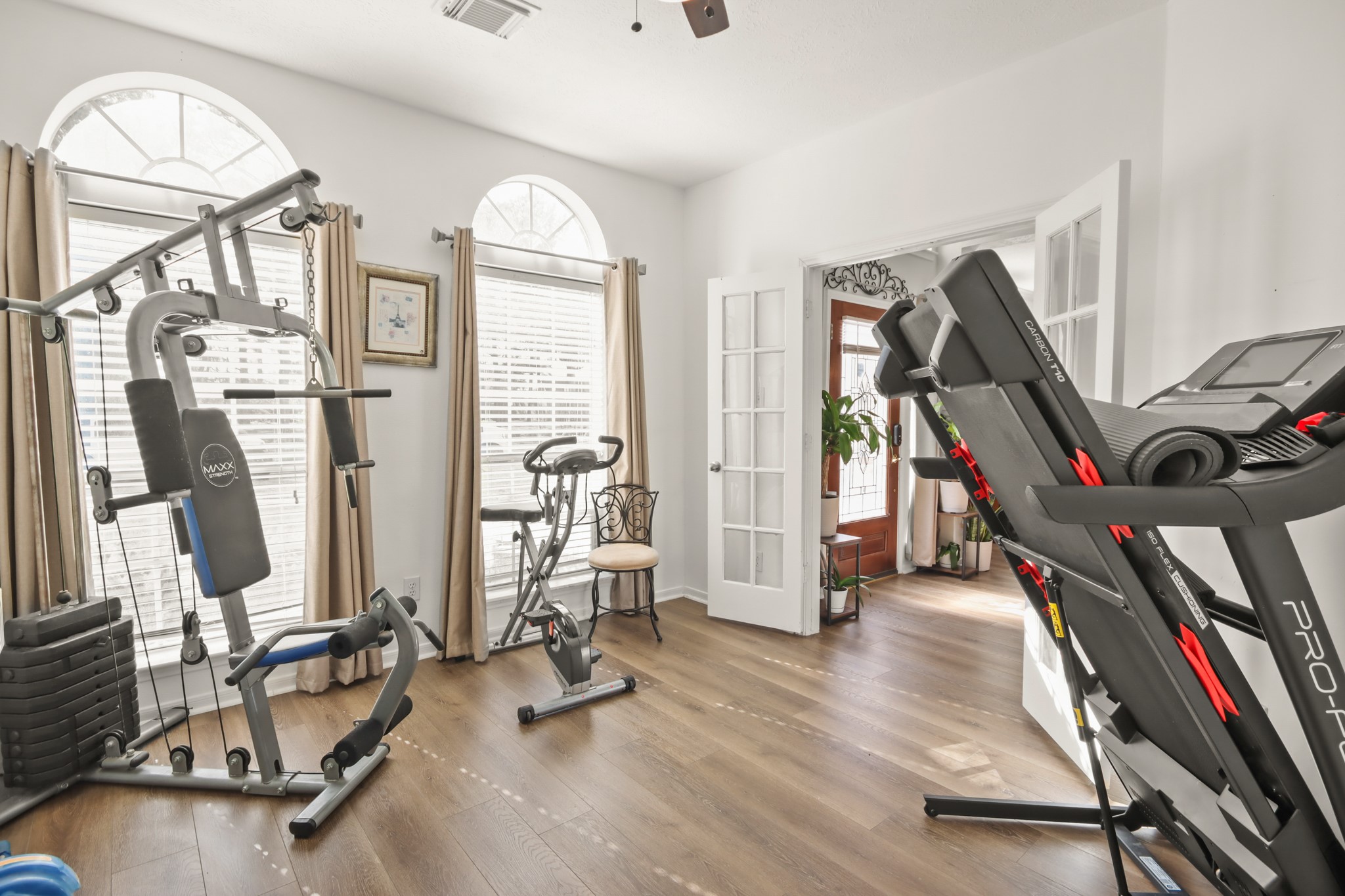 20514 Cannaberry Way Spring, TX 77388 - Photo 15 of 42 Versatile room currently arranged as a fitness area, offering endless possibilities including a game room, hobby space, or additional living area.