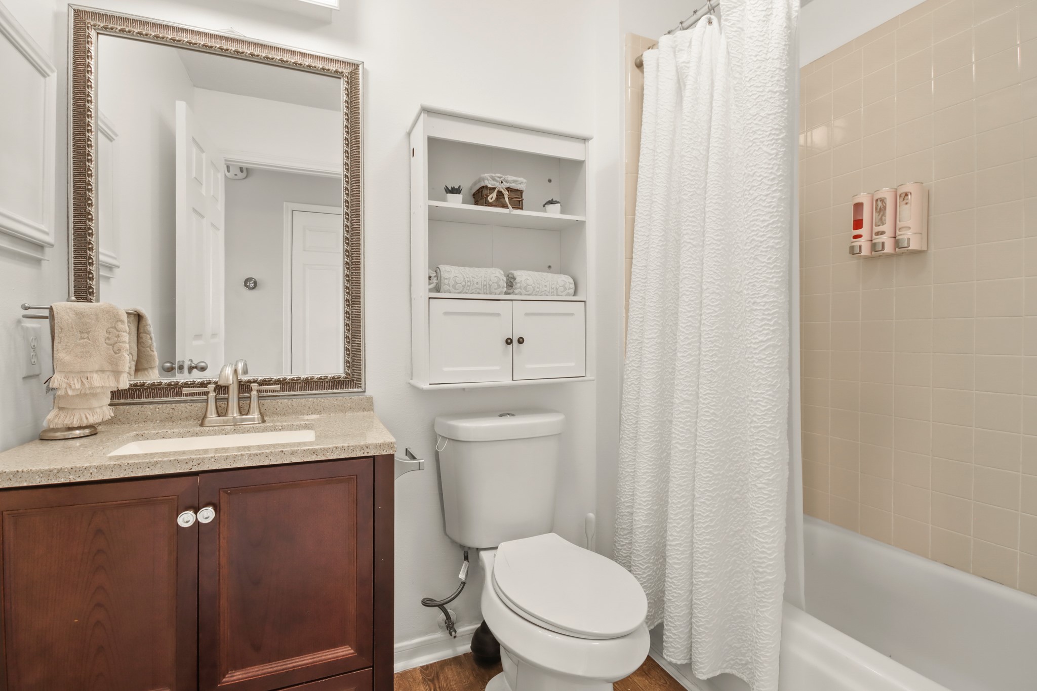 20514 Cannaberry Way Spring, TX 77388 - Photo 27 of 42 Well-maintained full bath featuring a sleek vanity, large mirror, and shower/tub combination.