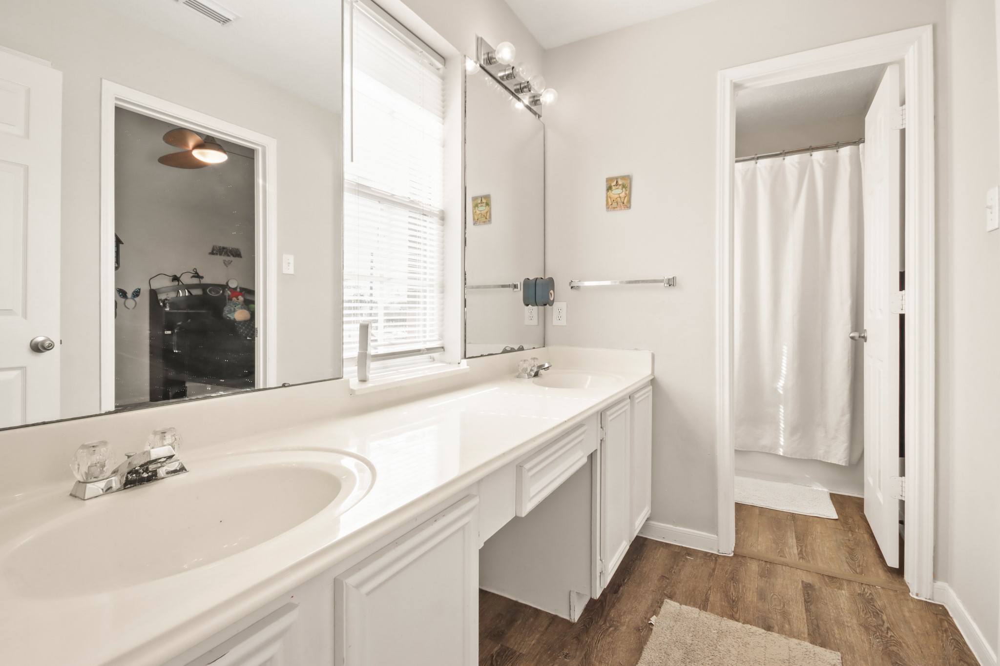 20514 Cannaberry Way Spring, TX 77388 - Photo 30 of 42 Bright hall bath featuring extended counter space, abundant lighting, and a clean, modern feel.