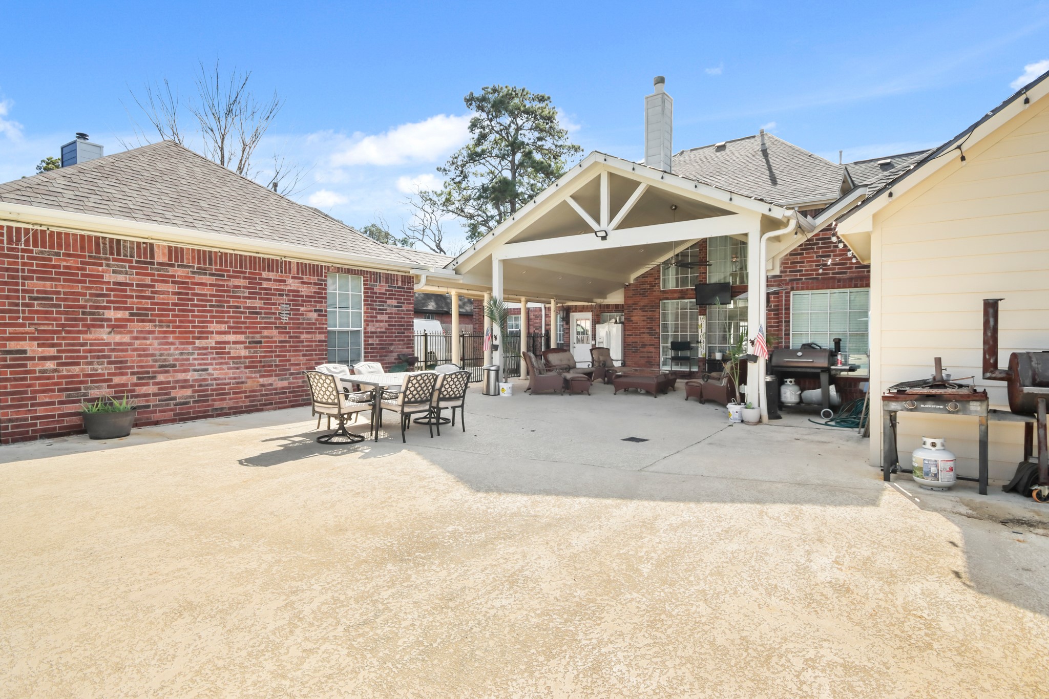 20514 Cannaberry Way Spring, TX 77388 - Photo 32 of 42 Exceptional outdoor living area featuring a large covered patio, ideal for hosting guests, outdoor dining, and enjoying year-round entertaining.