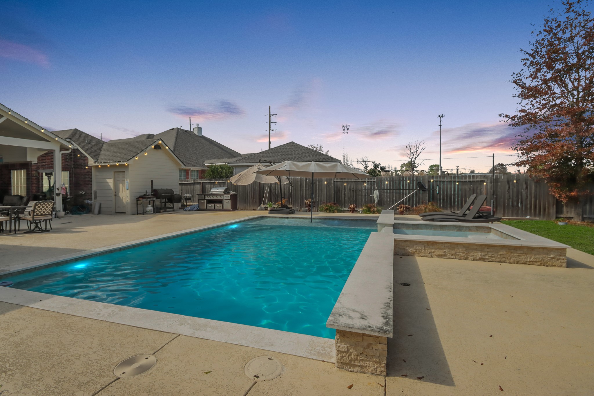 20514 Cannaberry Way Spring, TX 77388 - Photo 35 of 42 Pool area with expansive decking and ample room for lounge seating, perfect for entertaining or enjoying warm summer days.