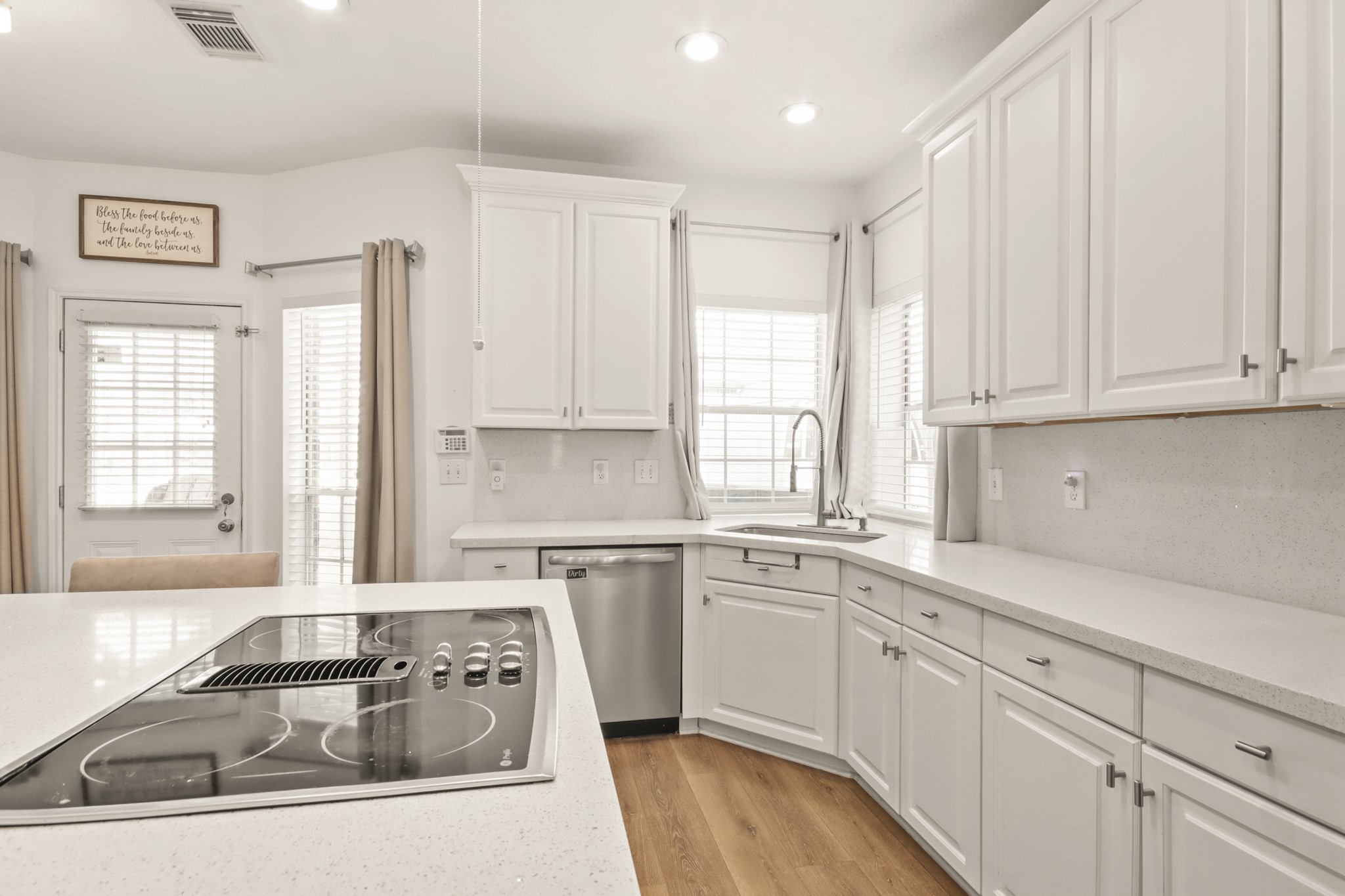 20514 Cannaberry Way Spring, TX 77388 - Photo 5 of 42 Light-filled culinary space showcasing abundant cabinetry, generous counter space, and a cozy breakfast nook overlooking the backyard.