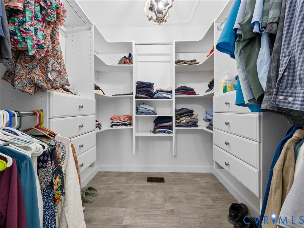 6126 Autumn Bluff Road Powhatan, VA 23139 - Photo 37 of 47 a view of walk in closet with clothes and shoes