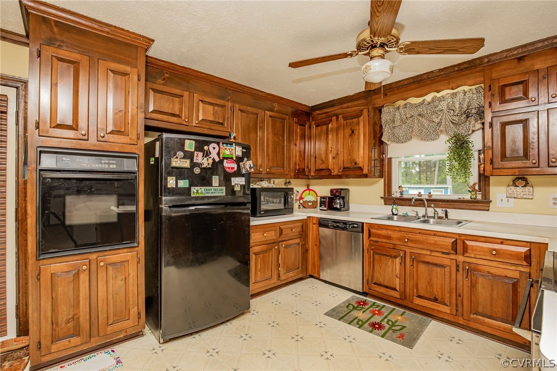 11460 Georgetown Road Mechanicsville, VA 23116 - Photo 6 of 28 a kitchen with stainless steel appliances granite countertop a refrigerator and a sink