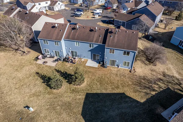 an aerial view of a house with a yard