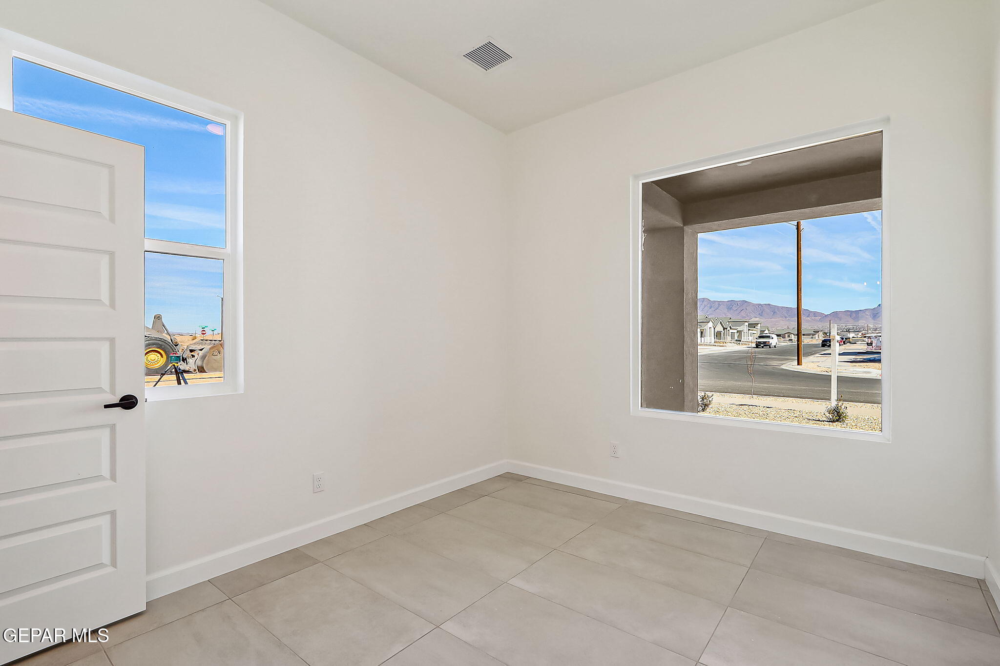5997 Ruidoso Downs Street El Paso, TX 79932 - Photo 16 of 42 an empty room with windows
